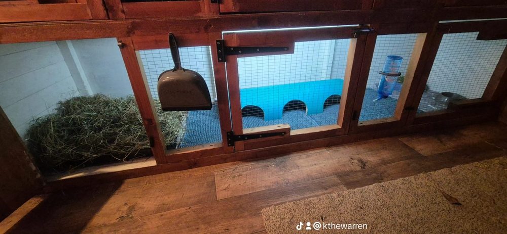 A lower hutch with deep hay, fleece and a long hideaway behind a mesh door